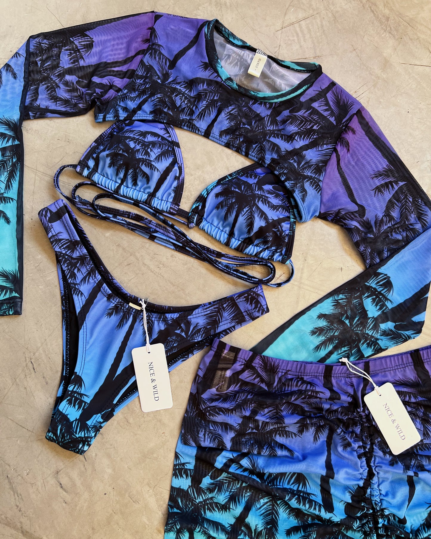 SET BIKINI PALMERA MORADA + FALDA EN MALLA