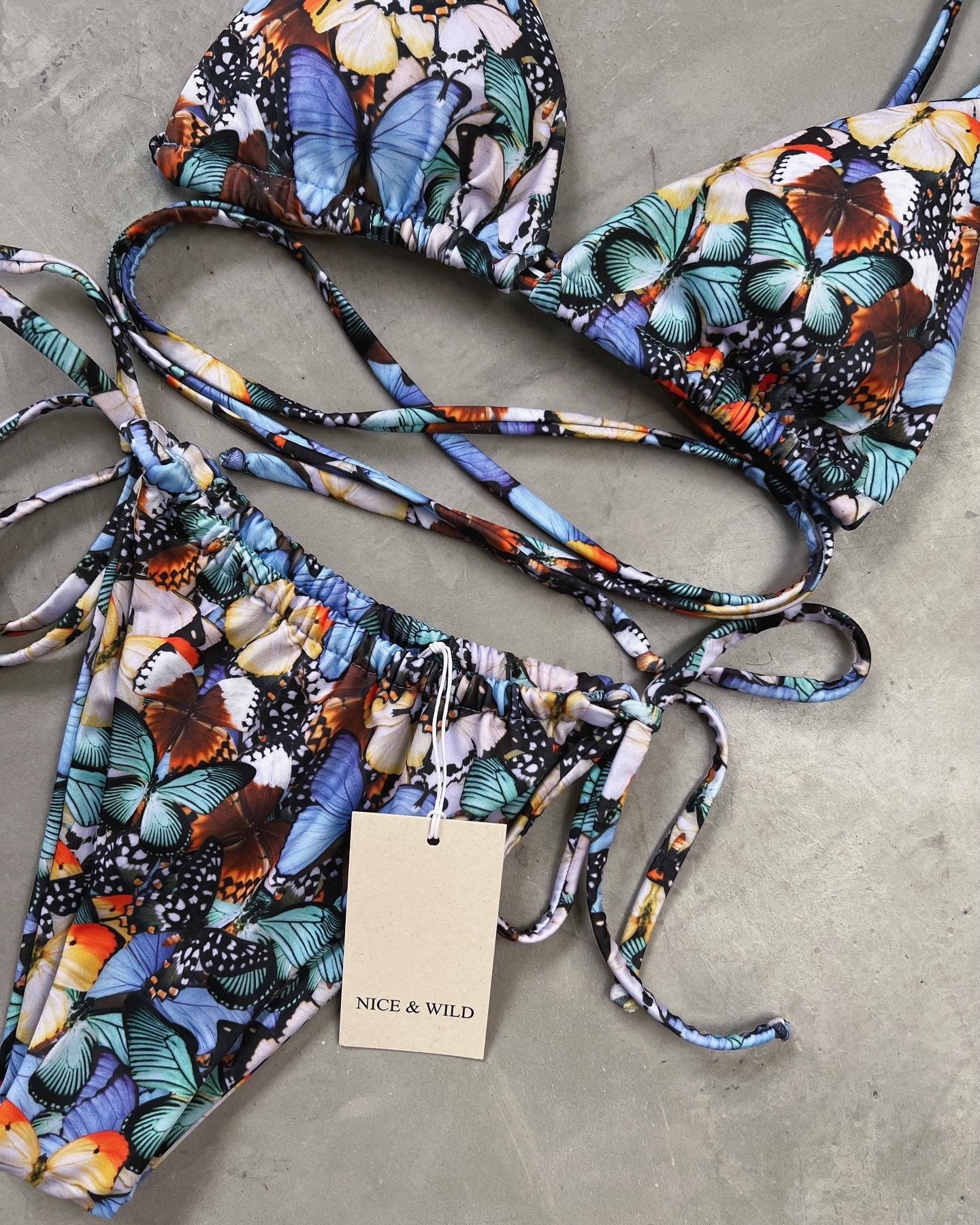 BIKINI BRONCEO MARIPOSAS LILA + FALDA EN MALLA