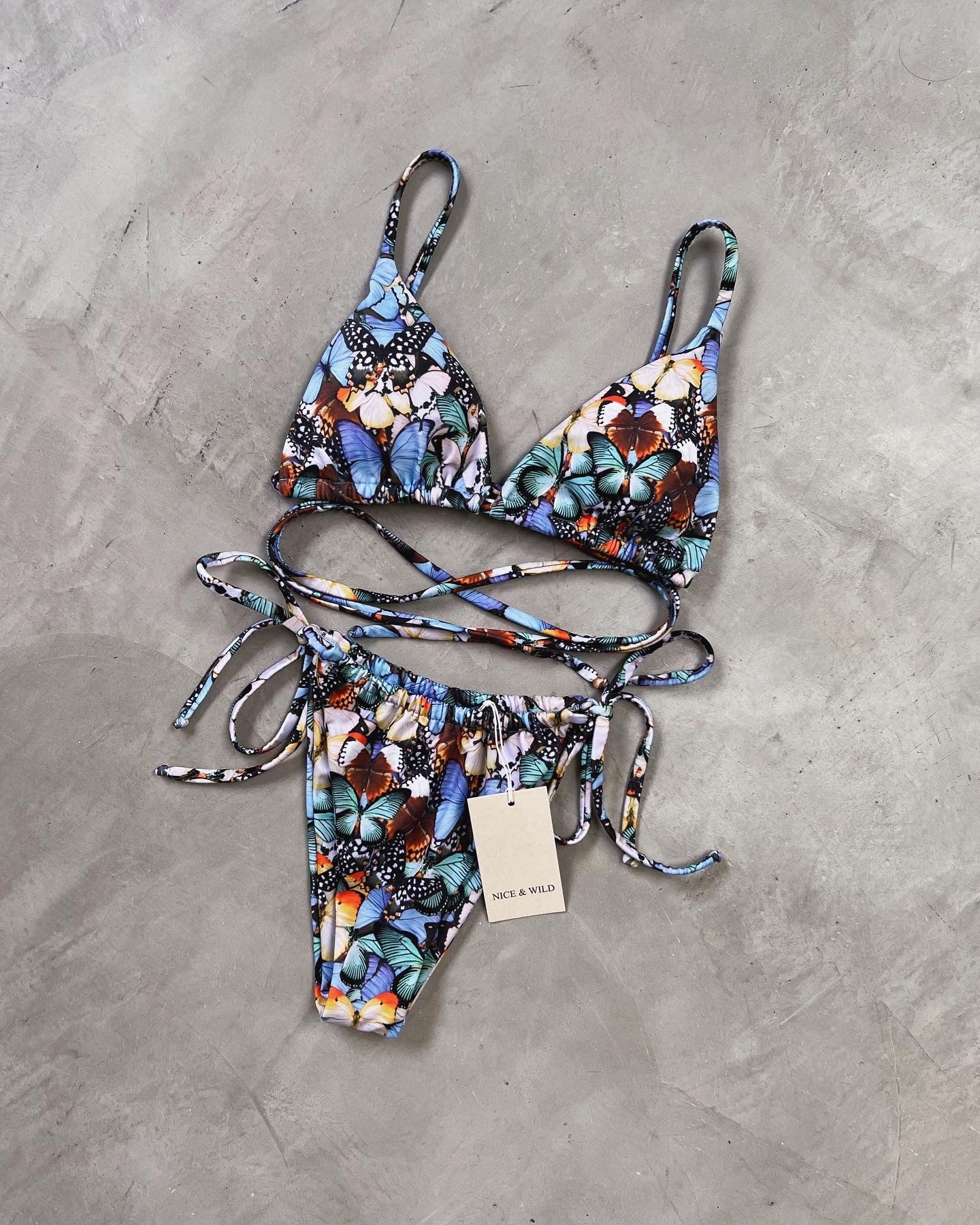 BIKINI BRONCEO MARIPOSAS LILA + FALDA EN MALLA